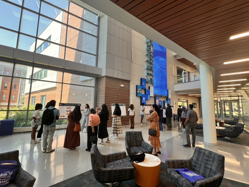 Students presenting at the poster session