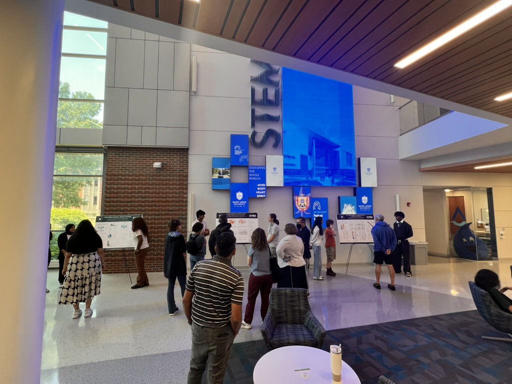 Students presenting at the poster session