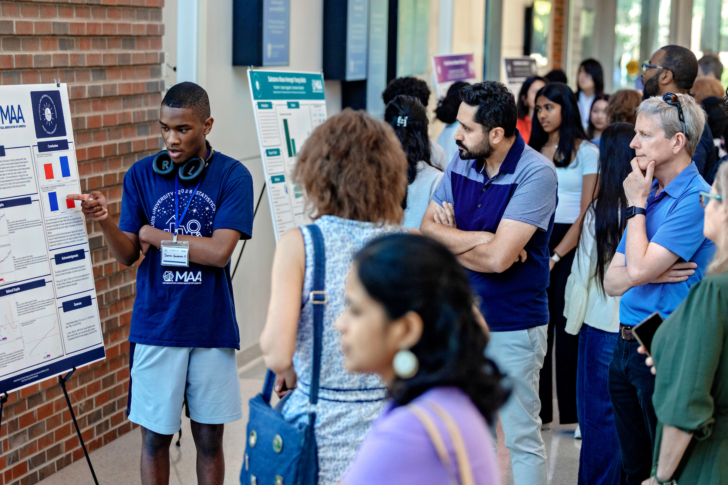 Students presenting at the poster session