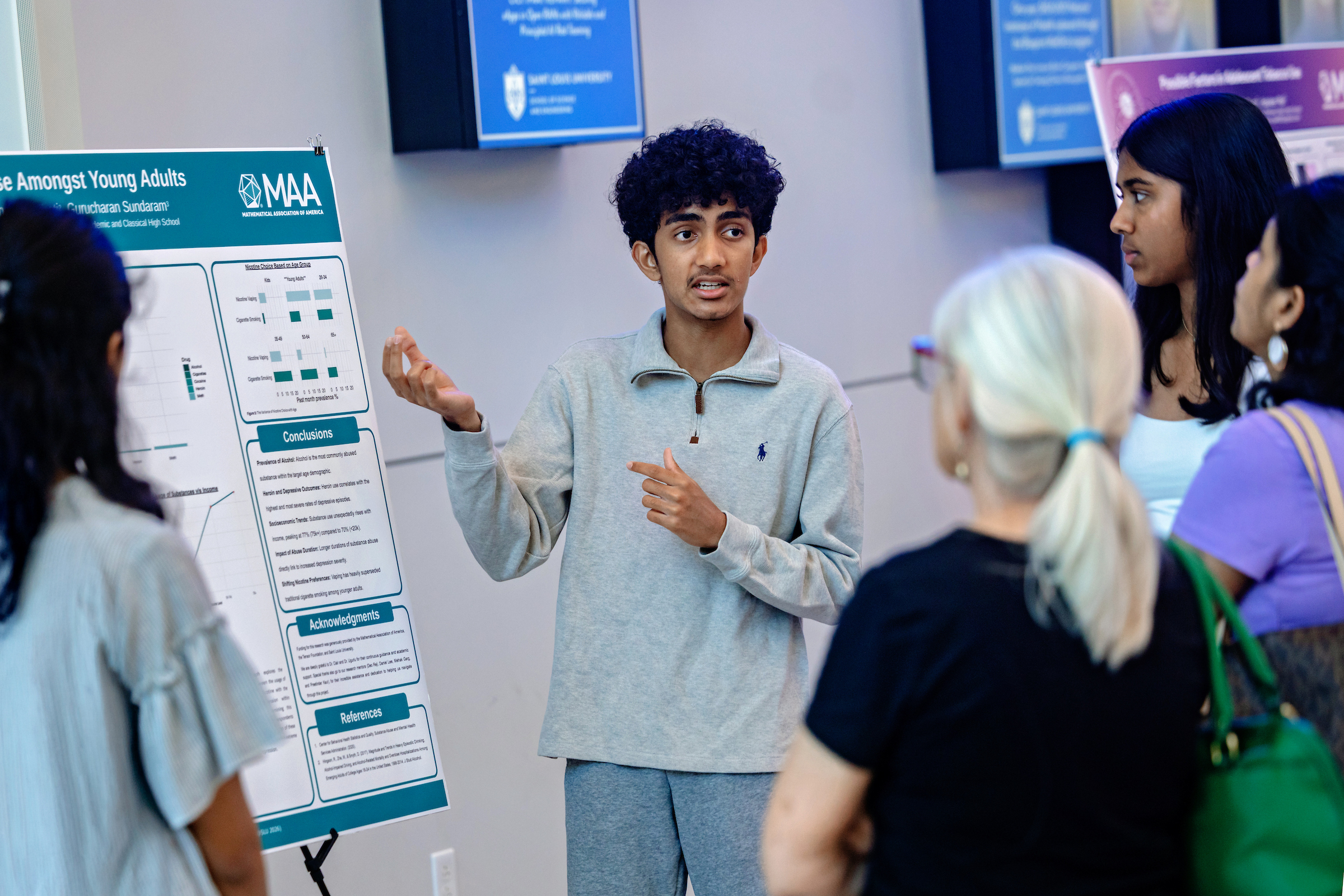 Students presenting at the poster session
