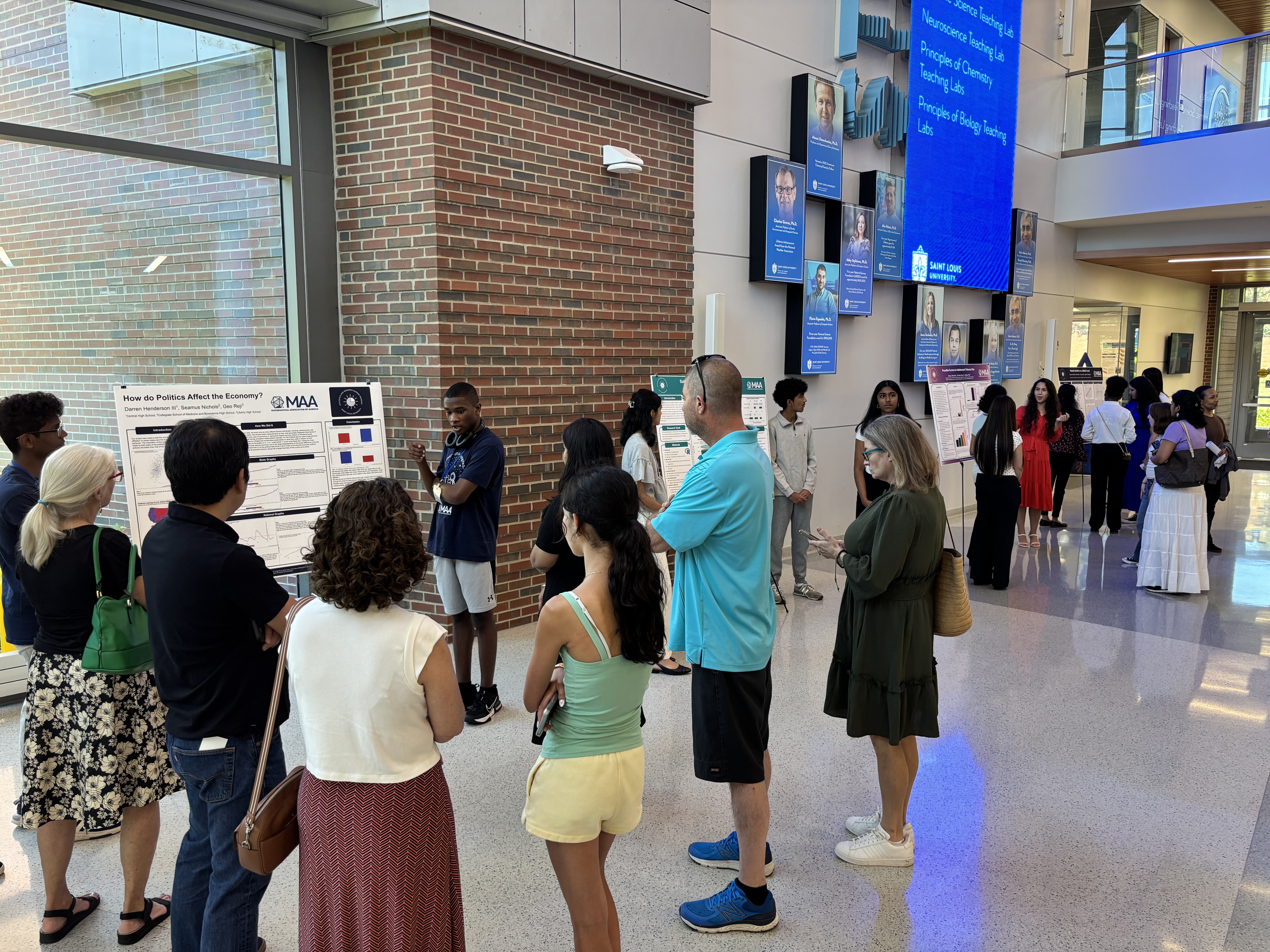 Students presenting at the poster session