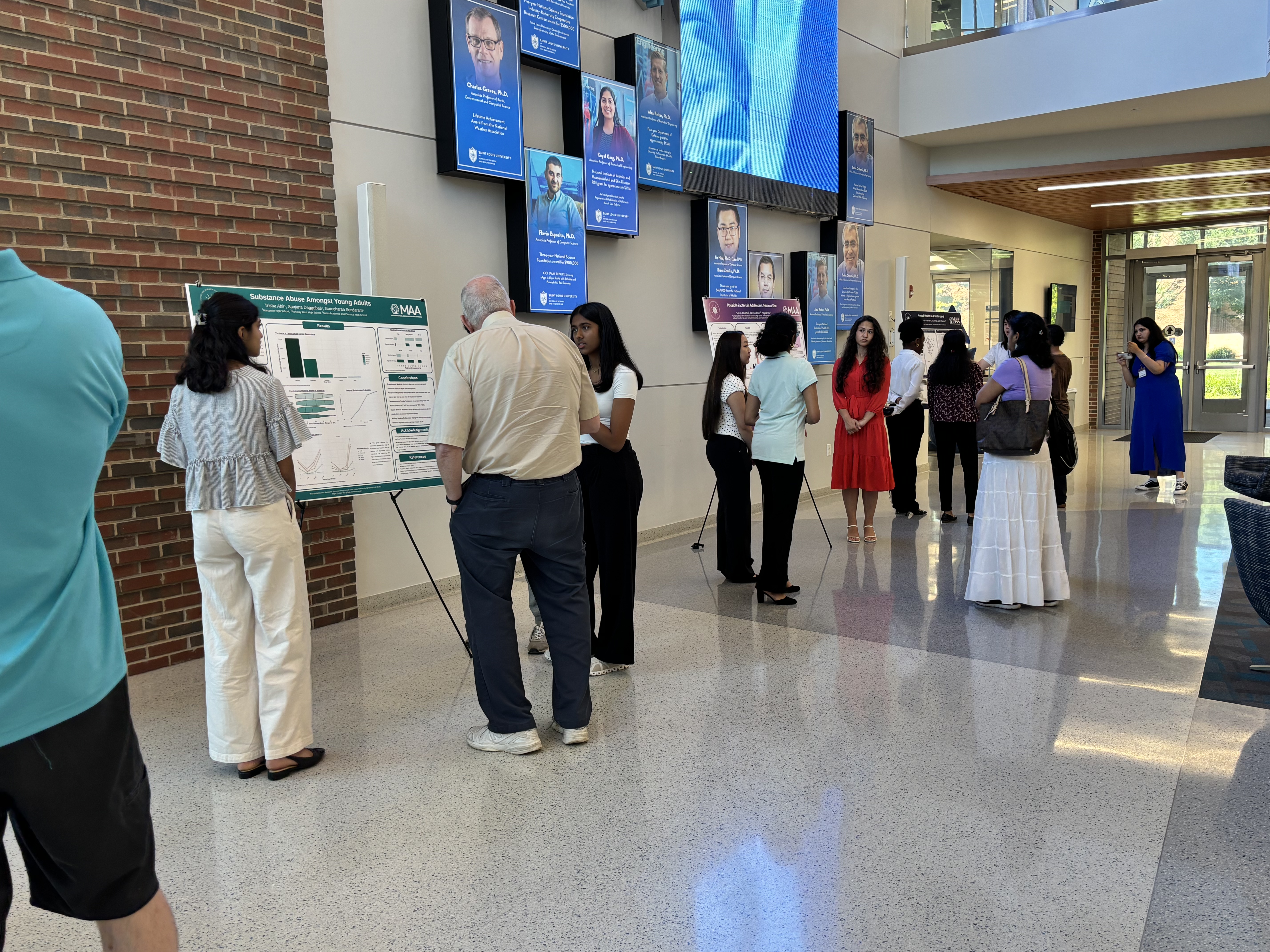 Students presenting at the poster session