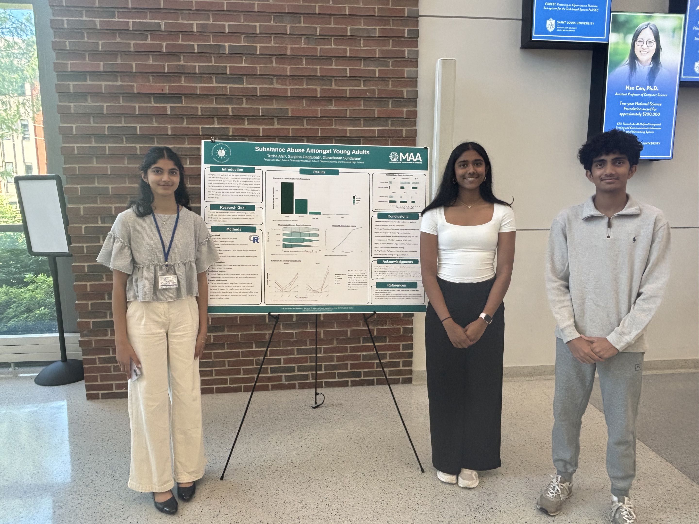 Students presenting at the poster session