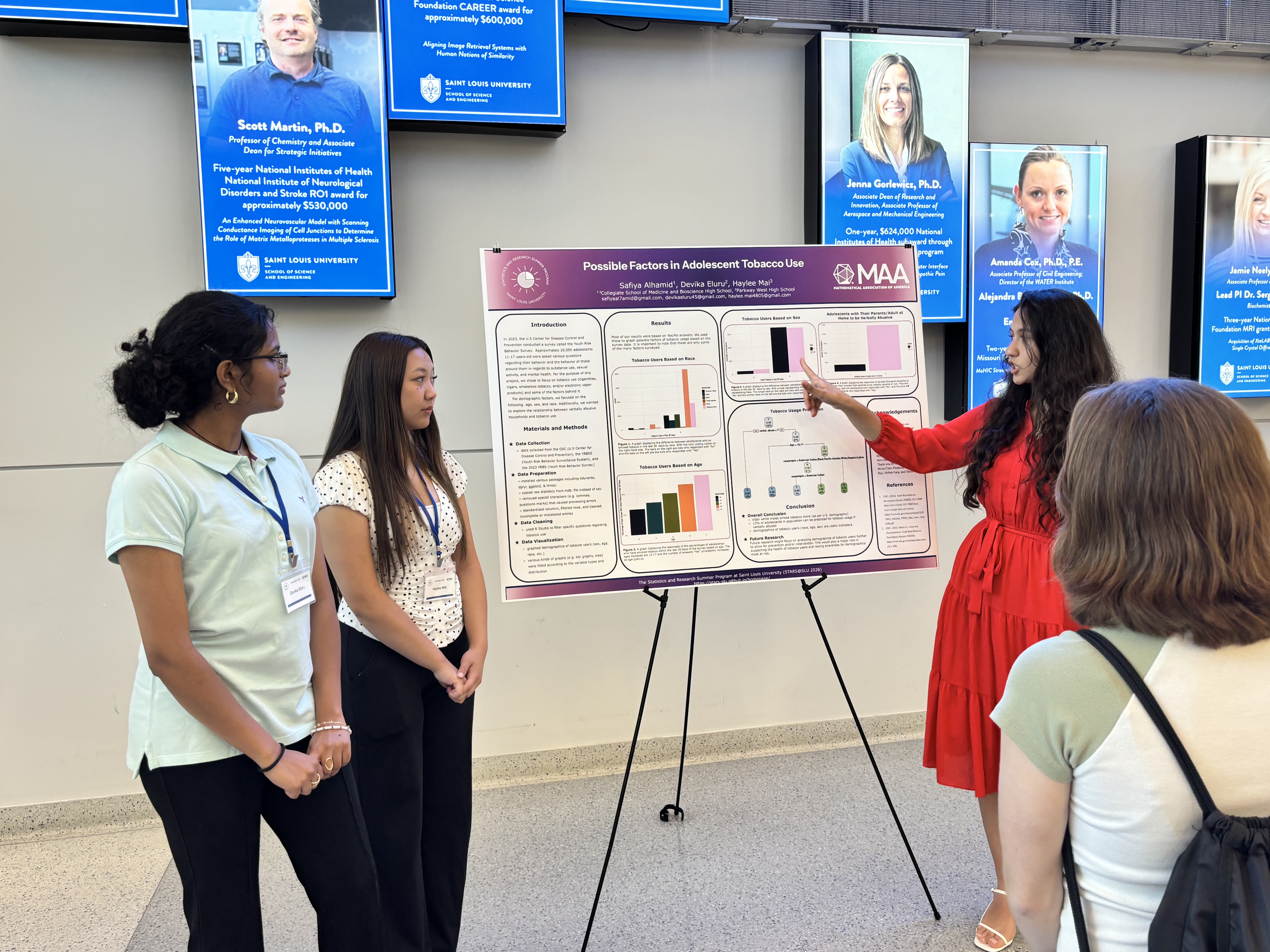 Students presenting at the poster session