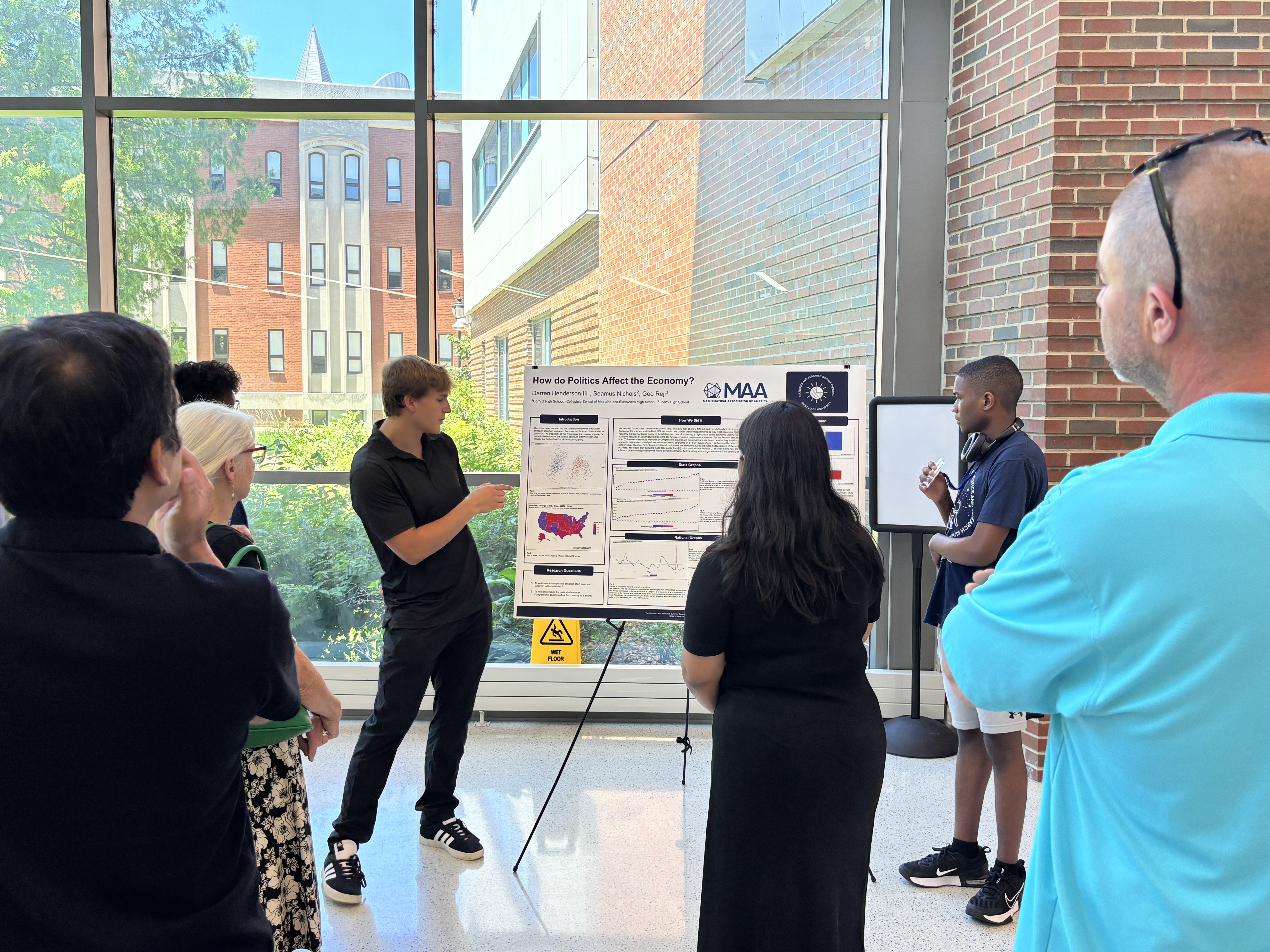 Students presenting at the poster session
